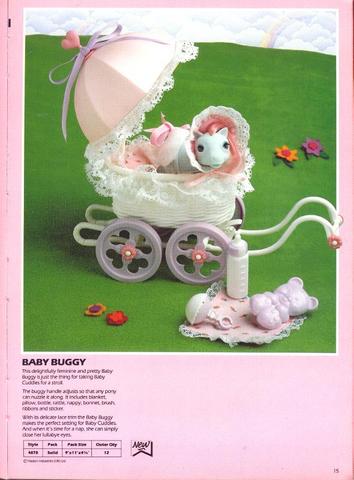 Pink and white buggy with
        baby Cuddles