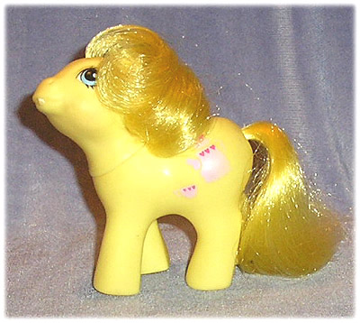 Gold baby
          pony with gold hair, teapot, first tooth