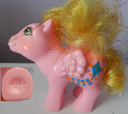 Baby
                  Mischief, Gold tinsel mane