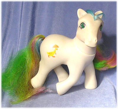 White earth
          pony with green, blue, pink, yellow hair, duck and umbrella
