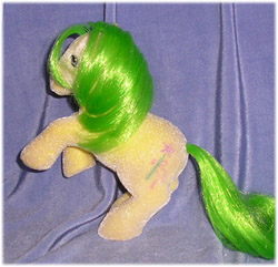 Yellow
          earth pony with green hair, wand symbol, flocked
