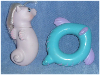 Lavender
          sea pony with fading pink hair, fish float