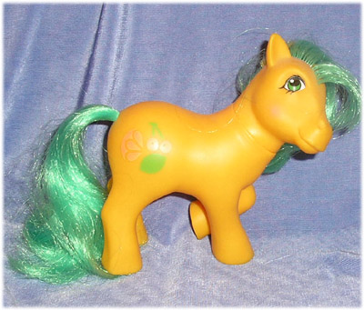 light
          orange pony with green and yellow hair, fruit